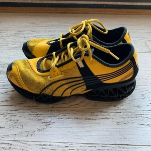 Men’s yellow Puma shoes